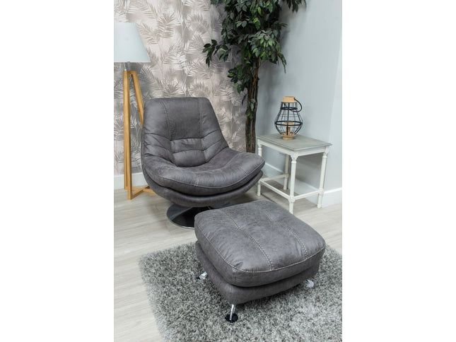 Dark grey fabric swivel chair with footstool